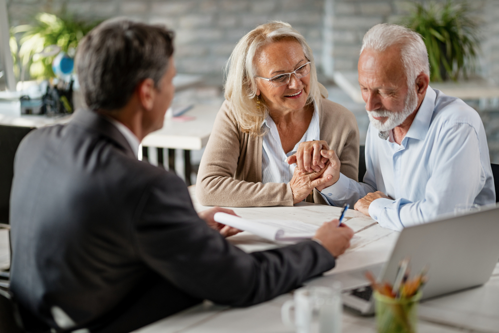 Happy,Senior,Woman,Encourages,Her,Husband,To,Sign,A,Contract
