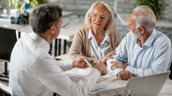 estate-planning-lawyer-discussing-with-two-clients-who-need-to-make-plans-for-estate-administration
